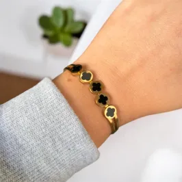 BRACELETE INOX DOURADO 5 TREVOS PRETO