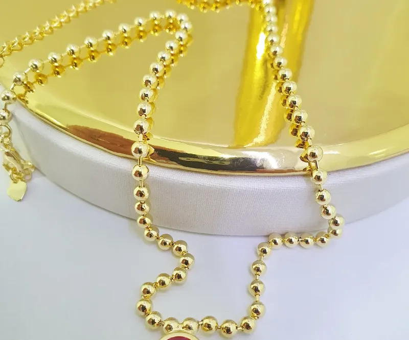 Colar de bolinhas com pedra de zircônia rubi